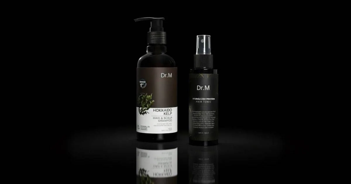 Dr. M Shampoo and Dr. M Tonic bottles.